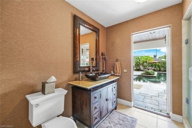 Set across two private, meticulously landscaped lots inside the - photo 35