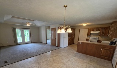 1,255 Square foot home with an open floor plan has a vaulted - photo 9