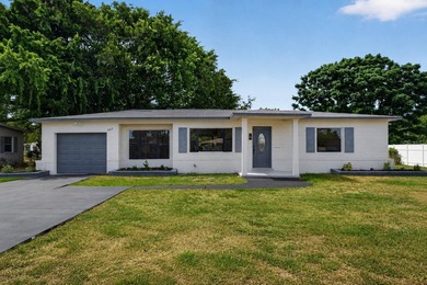 Welcome to this beautifully renovated 3-bedroom, 2-bathroom home - photo 1