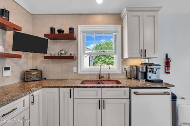 Custom-built in 2023 with water views, this meticulously - photo 9