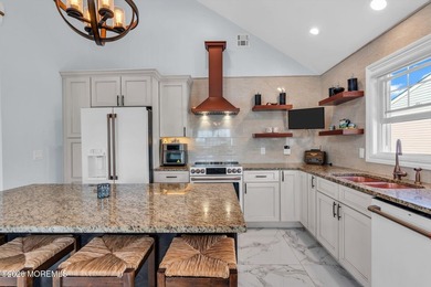 Custom-built in 2023 with water views, this meticulously - photo 10