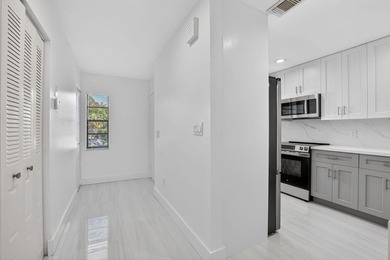 ABSOLUTELY STUNNING FULLY RENOVATED CONDO | BOCA LAGO COMMUNITY - photo 1