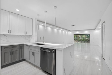 ABSOLUTELY STUNNING FULLY RENOVATED CONDO | BOCA LAGO COMMUNITY - photo 2
