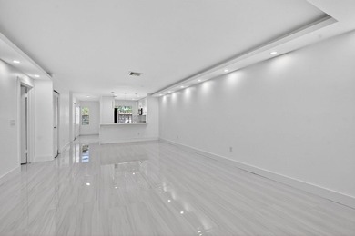 ABSOLUTELY STUNNING FULLY RENOVATED CONDO | BOCA LAGO COMMUNITY - photo 7