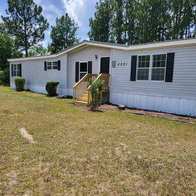Welcome to this 1,900-square-foot mobile home situated on 5 - photo 1