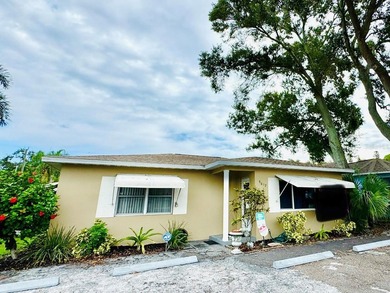 Discover a unique opportunity in Gulfport: this 4-bedroom - photo 1