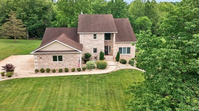 This custom-built one-and-a-half story home over a full walk-out - photo 1
