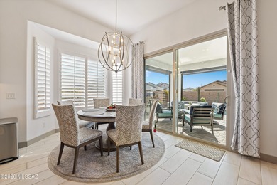 Set on a premium corner lot in the prestigious, gated 55+