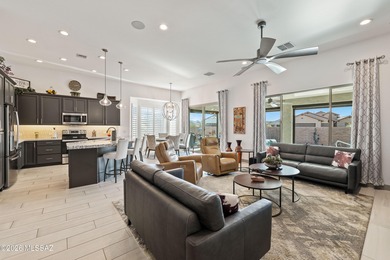 Set on a premium corner lot in the prestigious, gated 55+