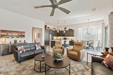 Set on a premium corner lot in the prestigious, gated 55+