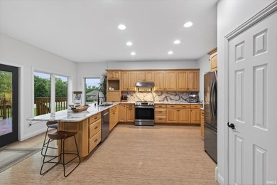 This custom-built one-and-a-half story home over a full walk-out - photo 6