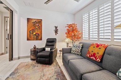 Set on a premium corner lot in the prestigious, gated 55+