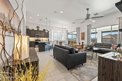 Set on a premium corner lot in the prestigious, gated 55+