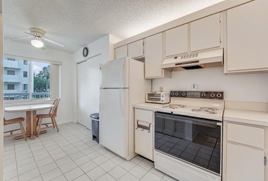 This turnkey 55+ community condo is move-in ready, featuring a - photo 7
