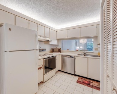 This turnkey 55+ community condo is move-in ready, featuring a - photo 8