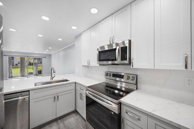 Welcome to this beautifully renovated condo offering a bright - photo 13