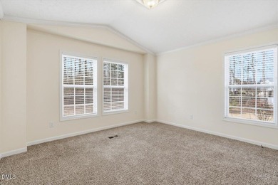 This beautiful home is set on nearly one acre of fully fenced