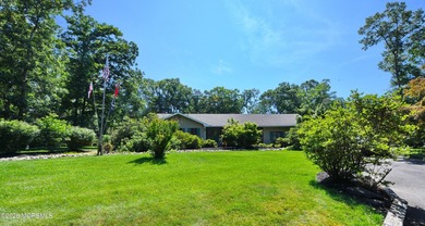 Welcome to this sprawling ranch tucked away on a tree-lined - photo 1