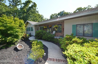Welcome to this sprawling ranch tucked away on a tree-lined - photo 4