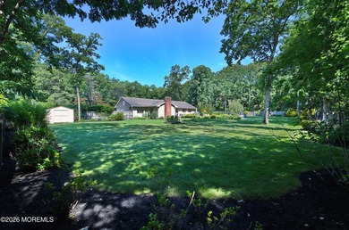 Welcome to this sprawling ranch tucked away on a tree-lined - photo 6