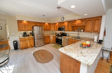 Welcome to this sprawling ranch tucked away on a tree-lined - photo 8