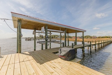 Experience true waterfront living with this custom-built - photo 3