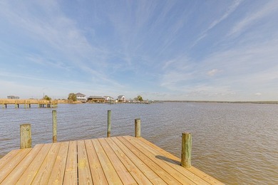 Experience true waterfront living with this custom-built - photo 4