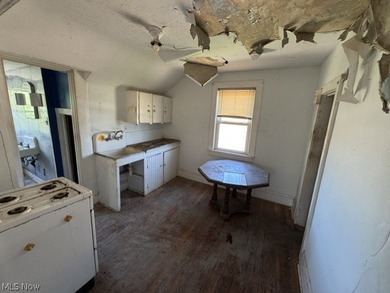 Investment Opportunity in this cape cod style home on the - photo 18