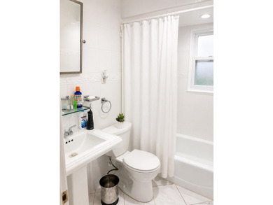 This well-maintained two-family home offers 4 spacious bedrooms - photo 5