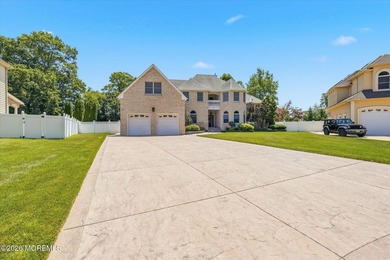 Offered for the first time, this custom-built home is nestled on - photo 2