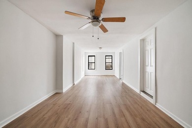 213 East 120th Street presents a compelling four-unit, mixed-use - photo 11