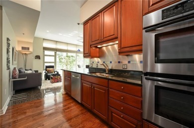 Modern Plaza-side condo with wraparound balcony and custom