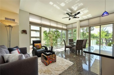 Modern Plaza-side condo with wraparound balcony and custom