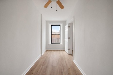 213 East 120th Street presents a compelling four-unit, mixed-use - photo 14