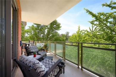 Modern Plaza-side condo with wraparound balcony and custom