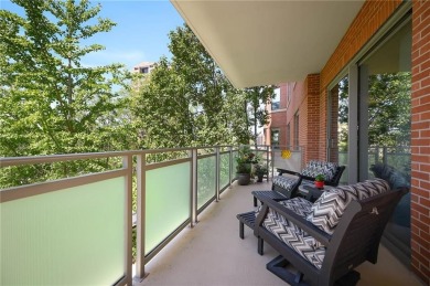 Modern Plaza-side condo with wraparound balcony and custom