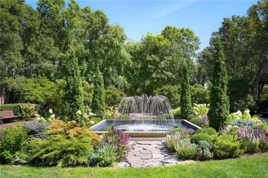 Modern Plaza-side condo with wraparound balcony and custom