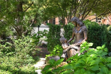 Modern Plaza-side condo with wraparound balcony and custom