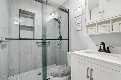 This beautifully renovated 3-bedroom concrete block home tucked - photo 4