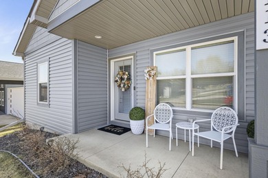 Sunlit, zero-entry living paired with a welcoming front porch - photo 2