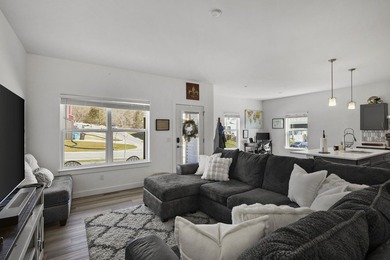 Sunlit, zero-entry living paired with a welcoming front porch - photo 3