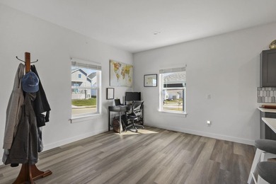 Sunlit, zero-entry living paired with a welcoming front porch - photo 8