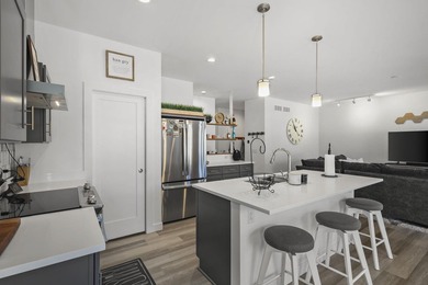 Sunlit, zero-entry living paired with a welcoming front porch - photo 10