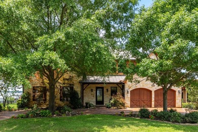 Exceptional lakefront living begins with a striking stone - photo 3