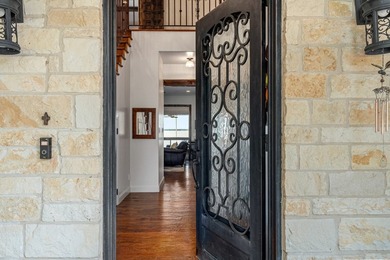Exceptional lakefront living begins with a striking stone - photo 4