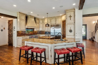 Exceptional lakefront living begins with a striking stone - photo 8