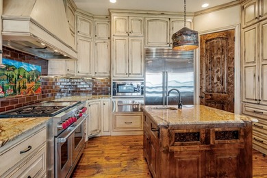 Exceptional lakefront living begins with a striking stone - photo 10