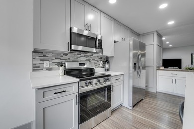 This stunning two-story residence has been completely remodeled - photo 4