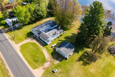 Discover the charm of lakeside living in this 4 bedroom, 2 bath - Lake Home For Sale in Grand Junction, Michigan