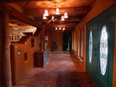 True Adobe style home in prestigious Alto Lakes Golf and Country